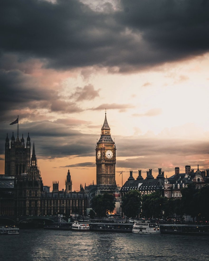 Westminster and the clock tower at dusk, seen across the Thames